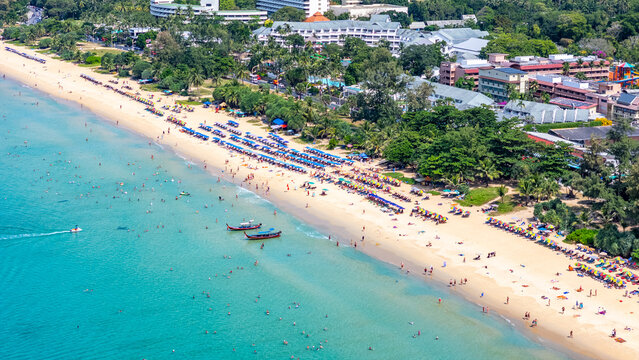 Colorful umbrellas and longtail boats Karon Beach Phuket southern Thailand