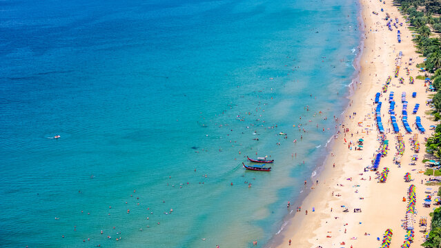Colorful umbrellas and longtail boats Karon Beach Phuket southern Thailand