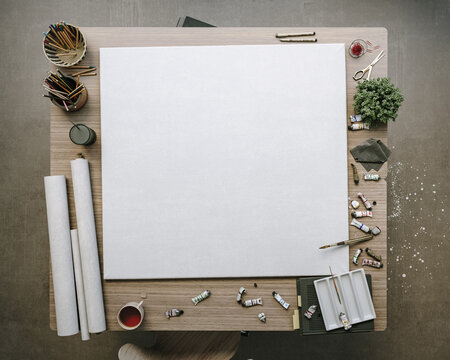 Blank Canvas Mockup on Table in Contemporary Artist Studio, Loft Style Interior, 3D Render