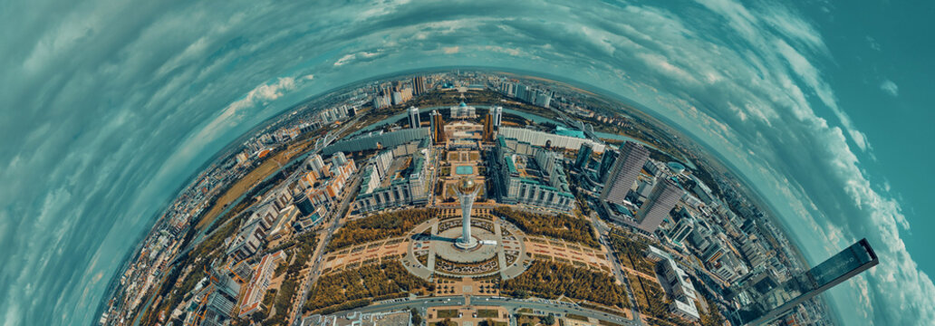 Beautiful panoramic aerial drone top-down view to Astana (Nursultan) city center with skyscrapers and Baiterek Tower - symbol of Kazakh people freedom, and Khan Shatyr Entertainment Center