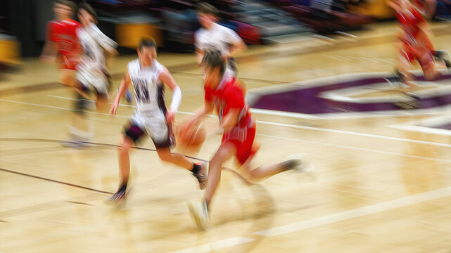 High School Basketball with motion blur showing the speed and movement of the young boys playing the game at Oxford HS in Upstate NY
