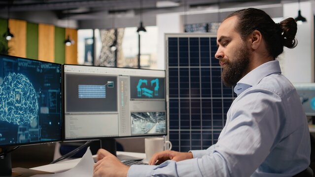 RD department researcher using machine learning tech to study solar green energy systems. Engineer using neural networks in office to improve photovoltaics assembly lines carbon footprint, camera A