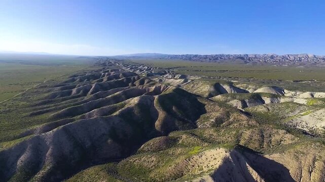 An aerial flyby over the Devil's Backbone Ridge of the Carrizo Plain in Central California.  The formation is a pressure ridge and is one of the most visible artifacts of the famous San Andreas Fault.