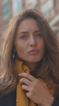 Concerned city dweller with scarf, An apprehensive person in city exhibiting worried expressions and gestures