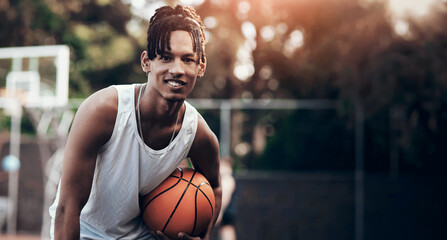 Fitness, portrait or athlete on basketball court with ball, athletic hobby or practice on weekend break. Space, bokeh or African man with roundball, hoop sport and training session in free time. © peopleimages.com