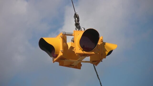 Flashing 4-way stoplight. Cloudy sky. HDV footage. HD.