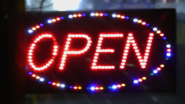 Open sign with flashing LED lights. Shop advertising. Toronto, Canada. HD video. 