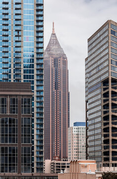 View of the Downtown Atlanta Skyline Cityscape showing several prominent buildings, and hotels on a cloudy afternoon.