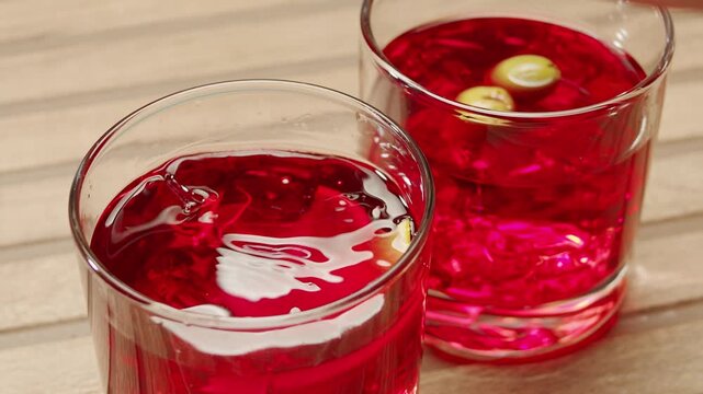 Vermouth Negroni, spanish wine drink, Alcoholic Americano Cocktail bitter, sweet vermouth and soda water, close up of making drink, summer spanish vacations. 