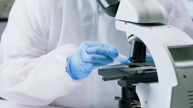 Engineer doctor working with microscope in laboratory, Scientific laboratory with various research equipment, man conducting experiments and research, Science and technology concept.