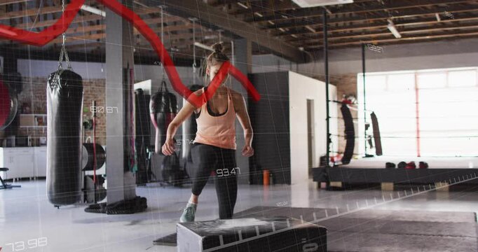 Approaching plyo box, woman doing step-ups and box jump while red overlay tracking training metrics