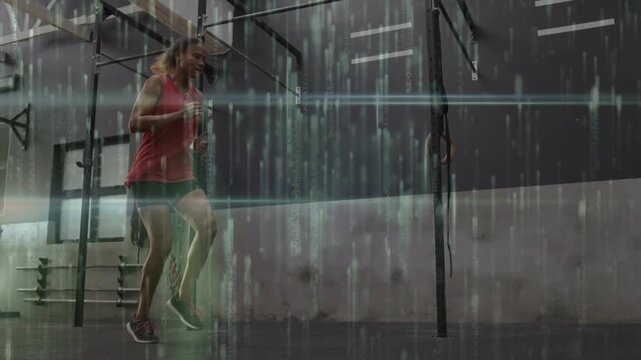 Woman starting hops near rig, increasing jumps while miming rope for cardio under streak overlay