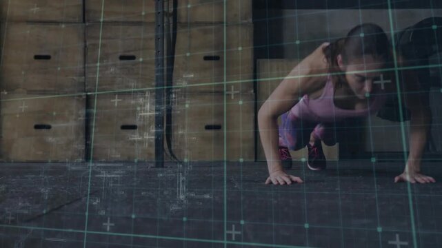 Woman athlete shifting weight, starting burpee on gym floor; grid overlay tracking form for fitness
