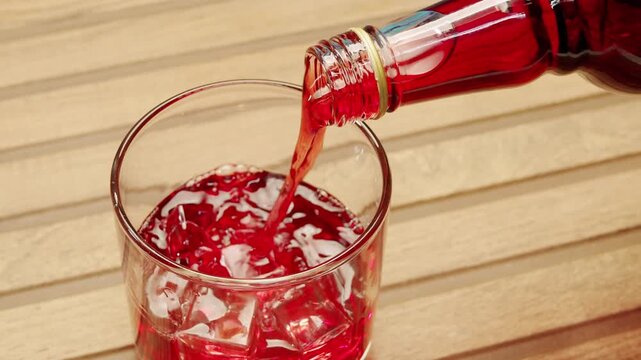 Vermouth Negroni, spanish wine drink, Alcoholic Americano Cocktail bitter, sweet vermouth and soda water, close up of making drink, summer spanish vacations. 