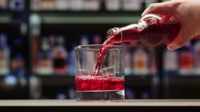 Vermouth Negroni, spanish wine drink, Alcoholic Americano Cocktail bitter, sweet vermouth and soda water, close up of making drink, summer spanish vacations. 
