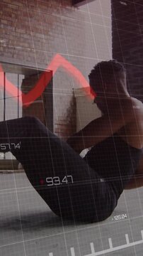 Vertical video: Male athlete starting V-sit, twisting with med ball while HUD tracking fitness