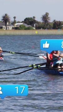 Vertical video: Two rowers training rowing across lake sparking social likes and hearts above boat