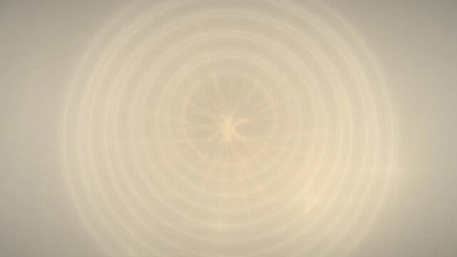 Sunburst radiates energy across a gradient gray field