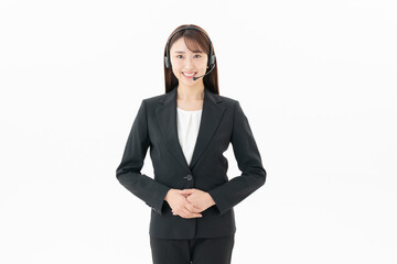 Obraz premium 白バックの若い女性オペレーター