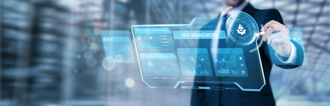 Businessman pointing at a digital screen and analyzing risk management strategy, enterprise risk assessment, financial and operational analytics, corporate risk mitigation
