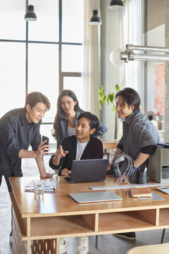 A team of business professionals working diligently in the office