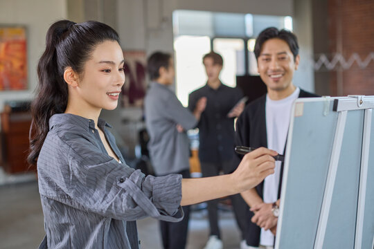 Business colleagues discussing strategies during an office meeting