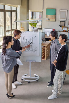 Business colleagues discussing strategies during an office meeting