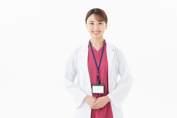 Fototapeta premium 白バックの若い女性の医者