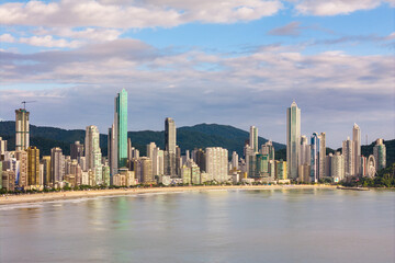 Fototapeta premium Coast of Balneario Camboriu City With Tall Skyscrapers and Dramatic Sky