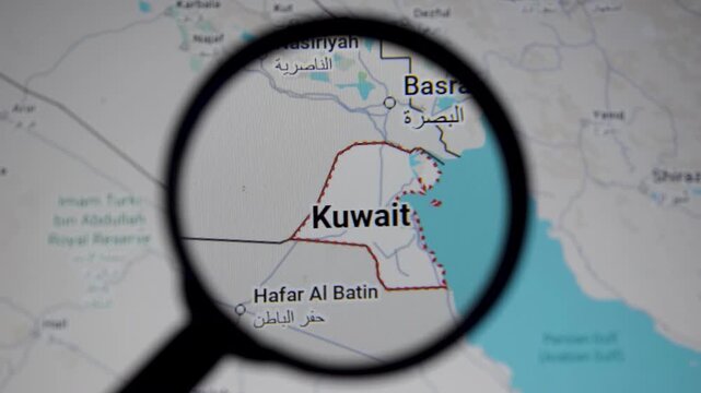 Map of Kuwait under magnifying glass highlighting Gulf region geopolitics, crude oil routes and Strait of Hormuz amid Iran war tensions, USA and Israel conflict, security threats and attack risks