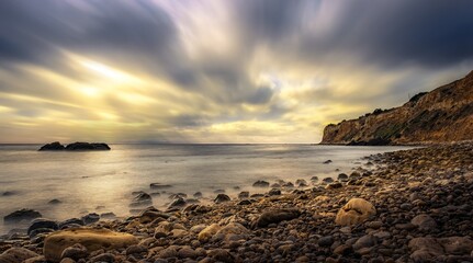 Obraz premium Peaceful California coastal landscape with golden light reflecting on ocean waves and soft shoreline textures