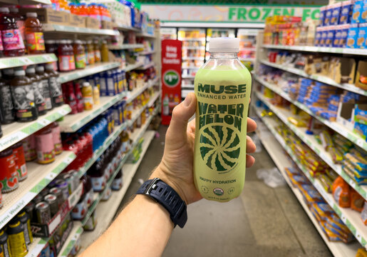 Muse Enhanced Water Bottle Held In Hand Dollar Tree Store Beverage Aisle