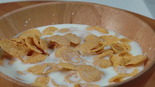 Milk Pouring into a Bowl of Corn Flakes
