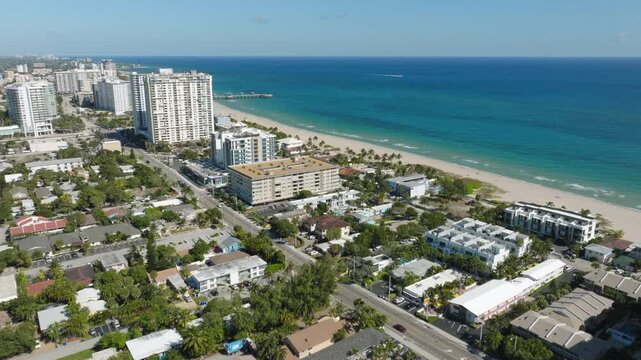 Aerial View of Pompano Beach With Pier, Bridge, Boats, Waterfront, Residential Blocks, Roads and Ocean Horizon