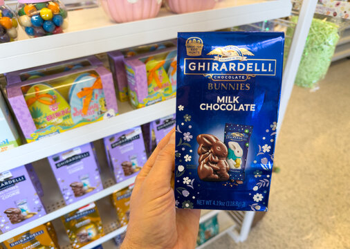 Ghirardelli Bunnies Milk Chocolate Candy Box Held In Hand In Store Aisle