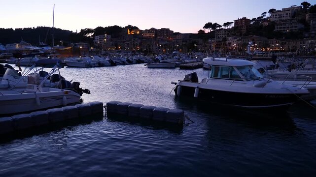 The marina of Port de S&oacute;ller at dusk, with the old town in the background. Mallorca, Spain