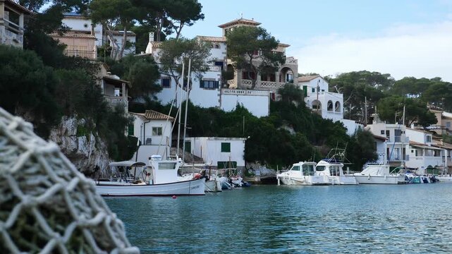 The marina of Cala Figuera with a fishing net in the foreground. Mallorca, Spain.