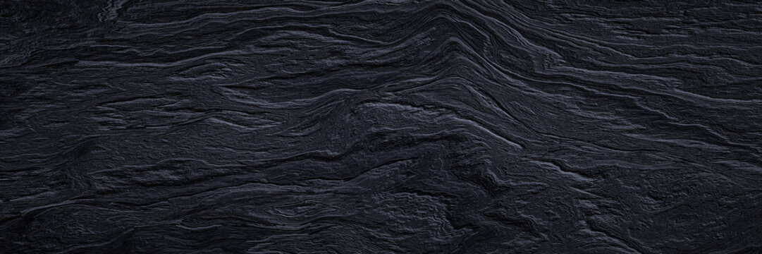Abstract cooled volcanic lava background. Black basaltic rock surface