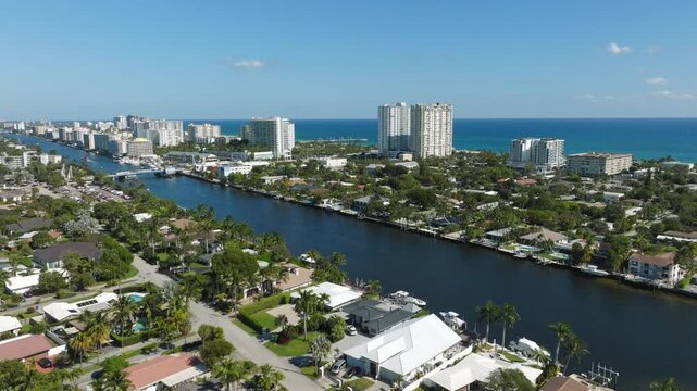Aerial View of Pompano Beach With Pier, Bridge, Boats, Waterfront, Residential Blocks, Roads and Ocean Horizon