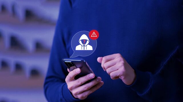 Phone scam alert notification concept. A woman holding a smartphone with a digital scam warning notification, fraudulent calls, cybersecurity threats, and telecommunication security awareness. fraud