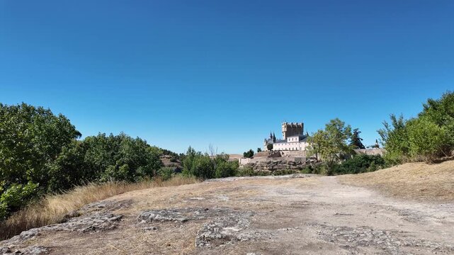 The Alc&aacute;zar of Segovia is one of the most iconic castles in Segovia, rising dramatically above the rocky cliffs where two rivers meet. Originally built as a fortress during the Middle Ages, it later b