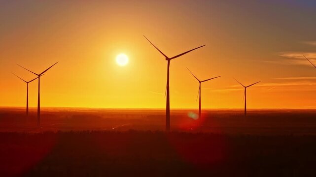 Onshore wind turbine farm renewable energy electricity industry sunrise sunset skyline