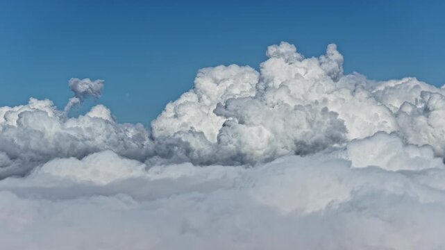 View from within clouds cumulus cumulonimbus formations cleasr blue color skyline