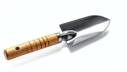 Fototapeta premium Simple metal garden hand trowel rests on white background, perfect for gardening, planting, digging, soil work, and landscaping projects in a minimal style.