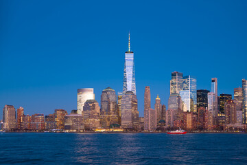NYC skyscrapers in a panoramic cityscape. New York City skyline wide banner view. Manhattan skyline with glass towers. NYC skyline as an urban landscape. New York panorama of the city skyline.