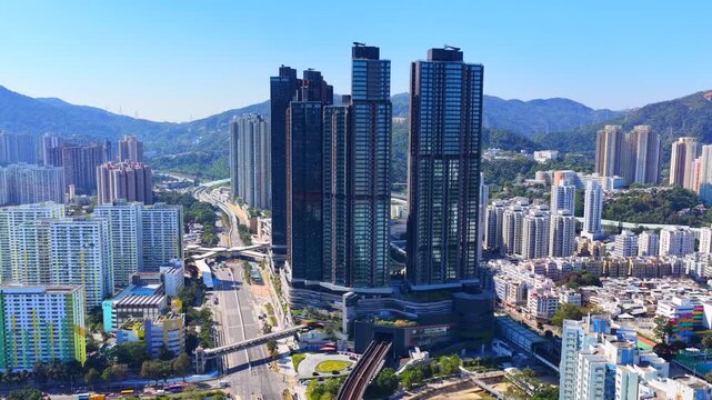 Tai Wai Station residential development in Hong Kong New Territories aerial view of high rise housing built over railway hub connecting to urban city centers solving shortages 