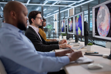 Diverse Team Of Scientists And Meteorologists Use Computers Analyzing Weather