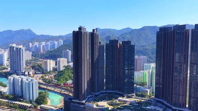 Tai Wai Station residential development in Hong Kong New Territories aerial view of high rise housing built over railway hub connecting to urban city centers solving shortages 