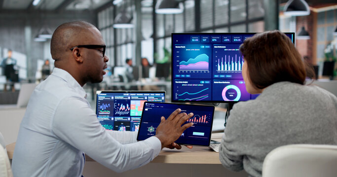 Business Analyst And Marketing Coach Examine KPI Dashboards