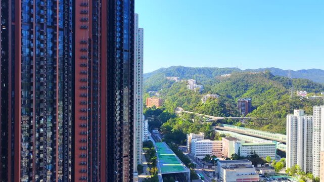 Tai Wai Station residential development in Hong Kong New Territories aerial view of high rise housing built over railway hub connecting to urban city centers solving shortages 